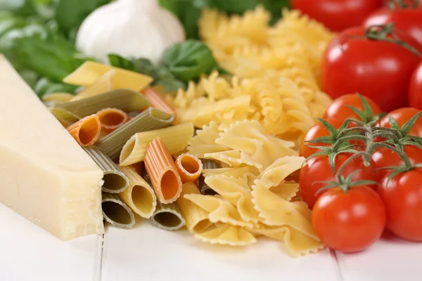 Ingredients for a Pasta noodles meal with tomatoes, penne, basil — Stock Photo, Image