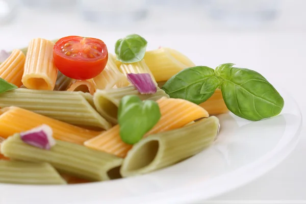 Colorful Penne Rigate noodles pasta meal with tomatoes — Stock Photo, Image