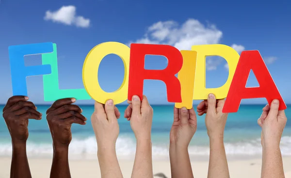 Hands holding the word Florida in summer on beach — Stock Photo, Image