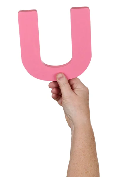 Hand holding letter U from alphabet — Stock Photo, Image