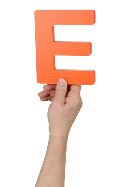 Hand holding letter E from alphabet — Stock Photo, Image