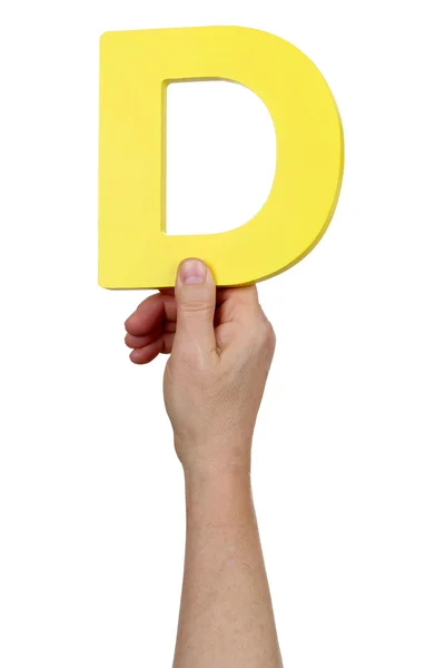 Hand holding letter D from alphabet — Stock Photo, Image