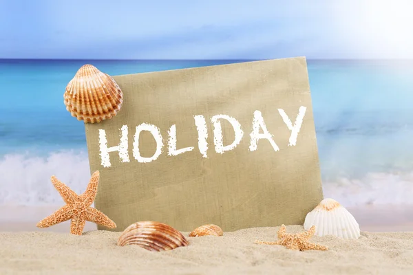 Beach scene in summer holiday with sea shells and stars — Stock Photo, Image