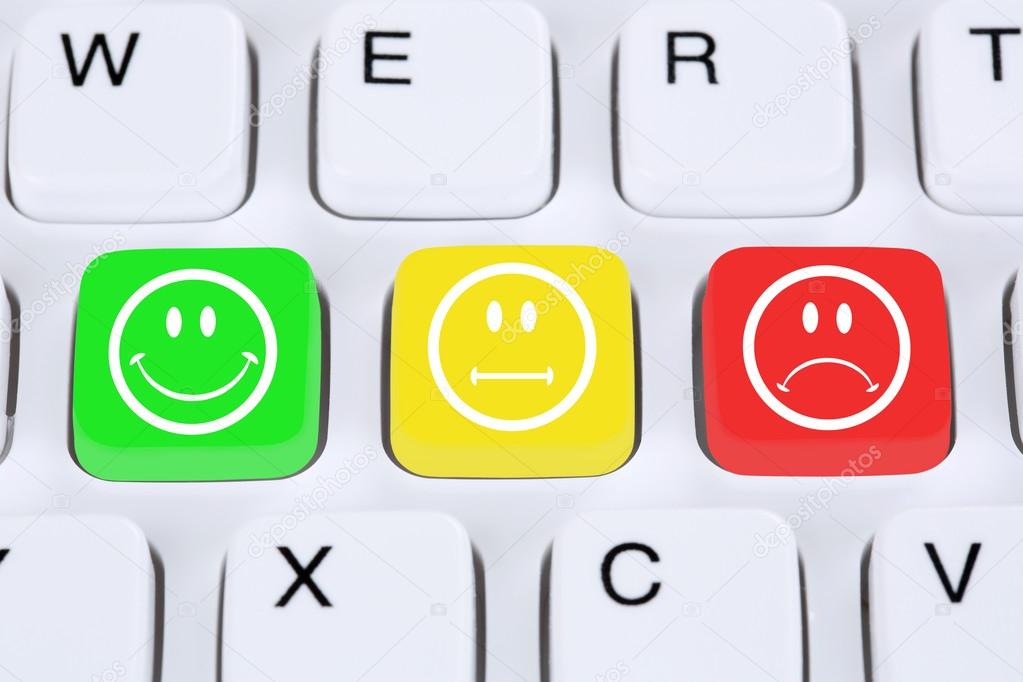 Choosing customer service quality with smiley on computer keyboa