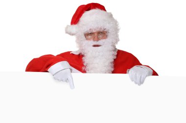 Santa Claus with beard pointing on Christmas at empty banner wit