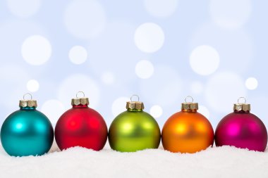 Colorful Christmas balls background decoration with snow