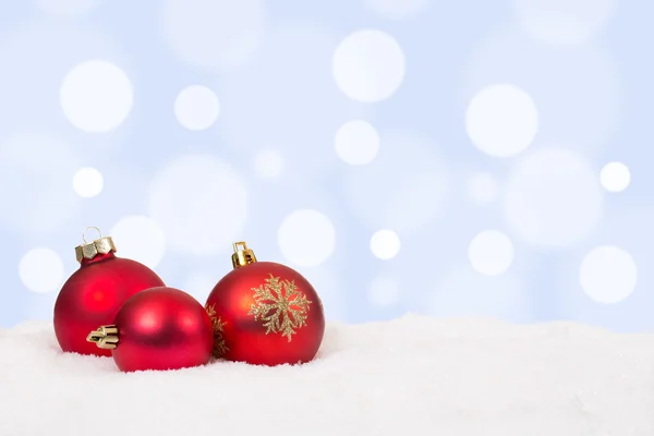 Red Christmas balls background decoration with snow Stock Picture