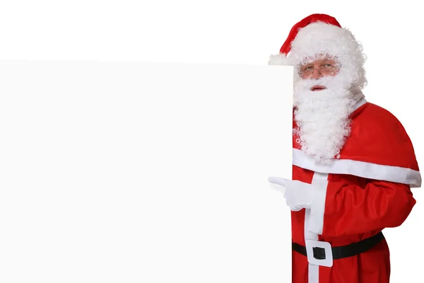 Santa Claus con sombrero apuntando a la Navidad en copas de banner vacías —  Fotos de Stock