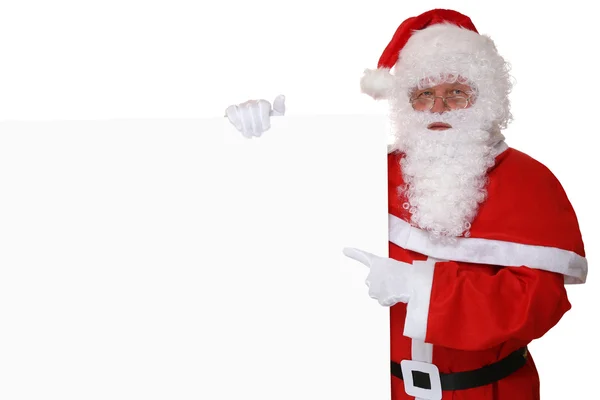 Santa Claus pointing with finger on Christmas at empty banner — Stock Photo, Image