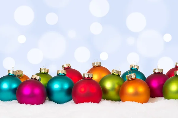 Christmas card many colorful balls with snow and copyspace — Stockfoto