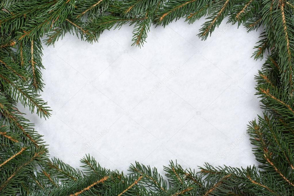 Christmas frame background with fir branches, snow and copyspace