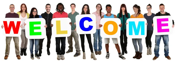 Group of young multi ethnic people holding word welcome — Stock Photo, Image