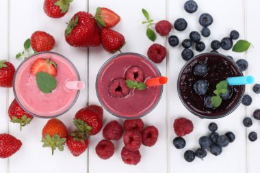 Smoothie fruit juice milkshake with fruits from above