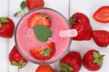 Strawberry smoothie fruit juice milkshake with strawberries frui
