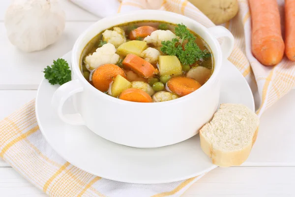 Vegetable soup with vegetables in cup — Stock Photo, Image