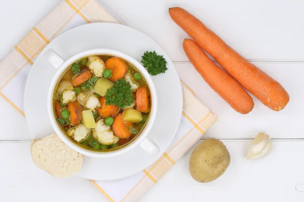 Vegetable soup meal with vegetables and carrots in bowl from abo — Stock Photo, Image