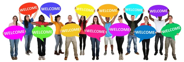 Refugees welcome group of young multi ethnic people holding spee — Stock Photo, Image