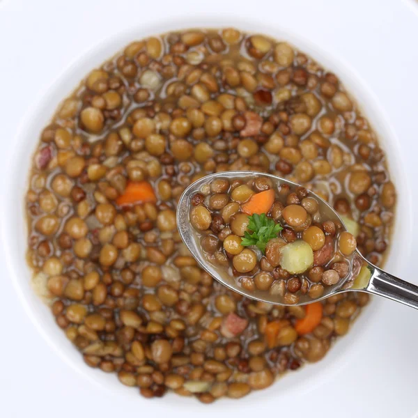 Healthy eating lentil soup stew with lentils on spoon from above — Stock Image Healthy eating lentil soup stew with lentils on spoon from above Royalty Free Stock Photos
