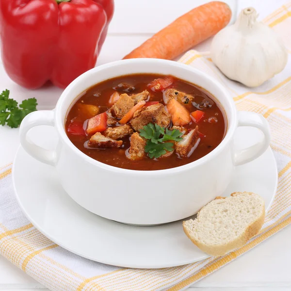 Goulash soup with meat, baguette and paprika healthy eating Stock Image