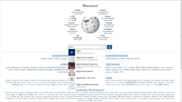 Searching wikipedia website for information about NATO — Stock Video