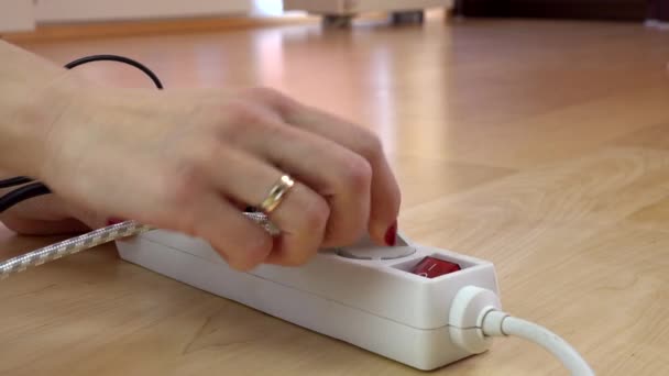 Girl hands unplug wires from electricity switch. — Stock Video