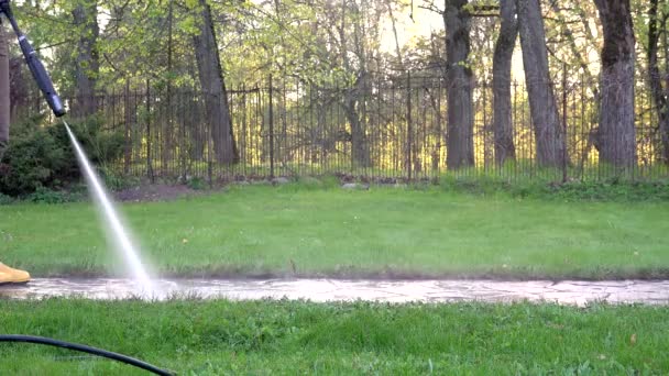 Close up of female spray clean path with high water pressure. 4K — Wideo stockowe