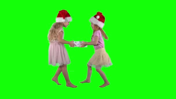 Cute little girls fighting for gift box. Chroma key green background. — Stock Video