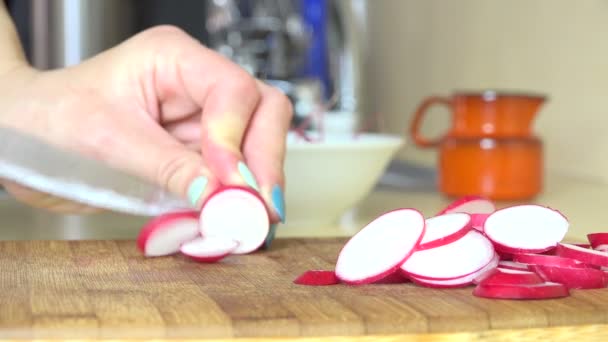 Hands cut organic radish on cutting board from garden. 4K — Stock Video