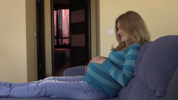 Pregnant woman caress stomach with love. Waiting for baby birth — Stock Video