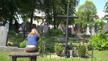 Woman experience painful father husband son man loss in cemetery. 4K