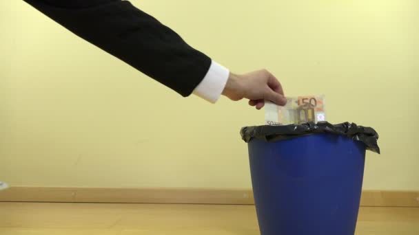 Concept of businessman hand throw euro in trash bin. 4K — Stock Video