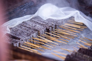 Pork blood cake is a kind of Taiwanese food made from rice and blood. It is usually sold at a food stand or night market in Taiwan. It will taste very delicious after it is coated with peanut powder clipart