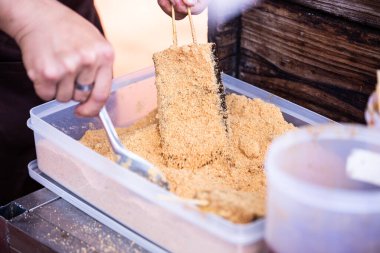 Pork blood cake is a kind of Taiwanese food made from rice and blood. It is usually sold at a food stand or night market in Taiwan. It will taste very delicious after it is coated with peanut powder clipart