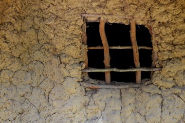 Wooden window in an african mud hut