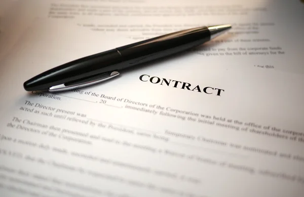black pen on a contract