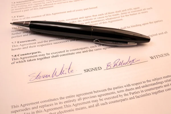 black pen on a contract