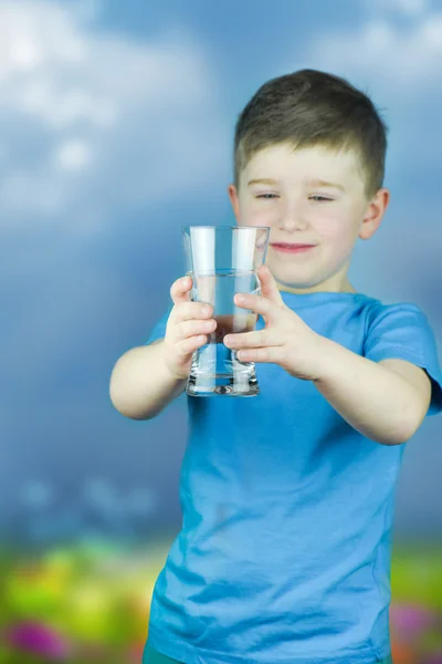 Portrait of boy drinking glass of water — Stock Photo, Image