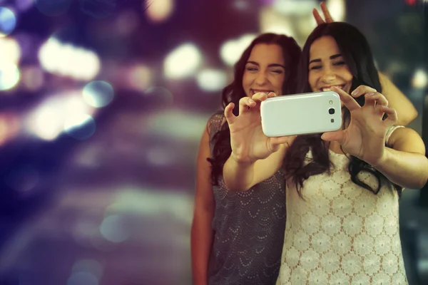 Friends making selfie. Two beautiful young women making "selfie" — Stock Photo, Image