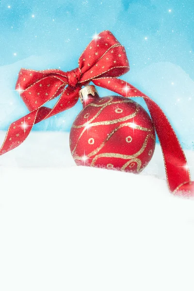 Red Christmas ball on the snow. — Stock Photo, Image