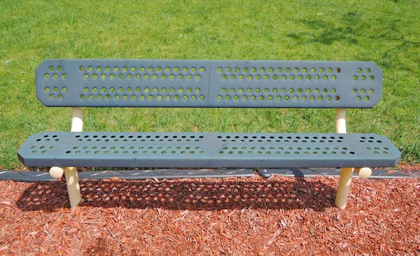 Closeup metal bench in the city