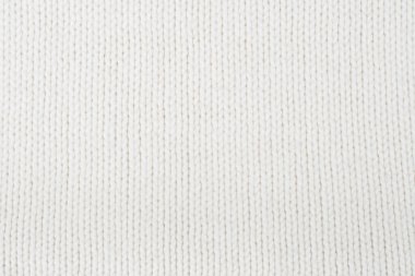 Süveter ya da atkı kumaş dokusu büyük örgü. Örülmüş forma ve kabartma desenli. Yün el yapımı makine, el yapımı.