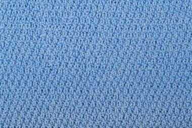 Süveter ya da atkı kumaş dokusu büyük örgü. Örülmüş forma ve kabartma desenli. Yün el yapımı makine, el yapımı.