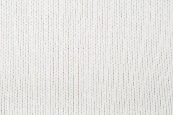 Süveter ya da atkı kumaş dokusu büyük örgü. Örülmüş forma ve kabartma desenli. Yün el yapımı makine, el yapımı.