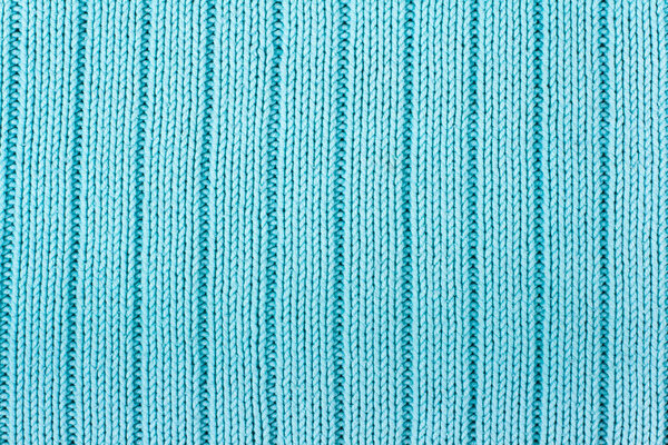 Свитер или ткань шарфа текстура большого вязания. Вязаный джерси фон с рельефным рисунком. Шерстяная ручная машина, ручная работа