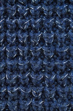Süveter ya da atkı kumaş dokusu büyük örgü. Örülmüş forma ve kabartma desenli. Yün el yapımı makine, el yapımı.