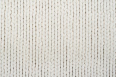 Süveter ya da atkı kumaş dokusu büyük örgü. Örülmüş forma ve kabartma desenli. Yün el yapımı makine, el yapımı.