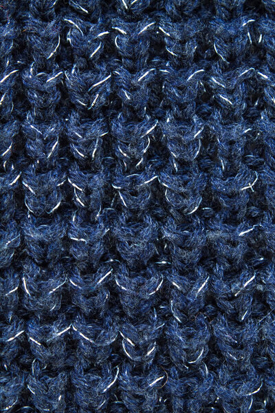 Свитер или ткань шарфа текстура большого вязания. Вязаный джерси фон с рельефным рисунком. Шерстяная ручная машина, ручная работа