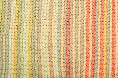 Süveter ya da atkı kumaş dokusu büyük örgü. Örülmüş forma ve kabartma desenli. Yün el yapımı makine, el yapımı.