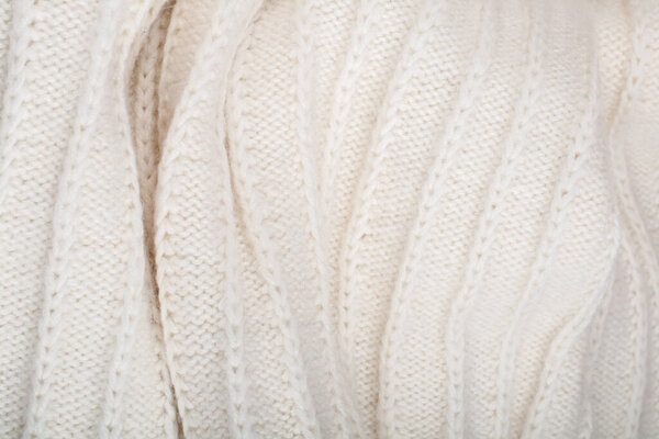 Свитер или ткань шарфа текстура большого вязания. Вязаный джерси фон с рельефным рисунком. Шерстяная ручная машина, ручная работа