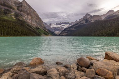 Turquoise Blue water at Lake Louise on a summer evening in Banff National Park, Alberta Canada.